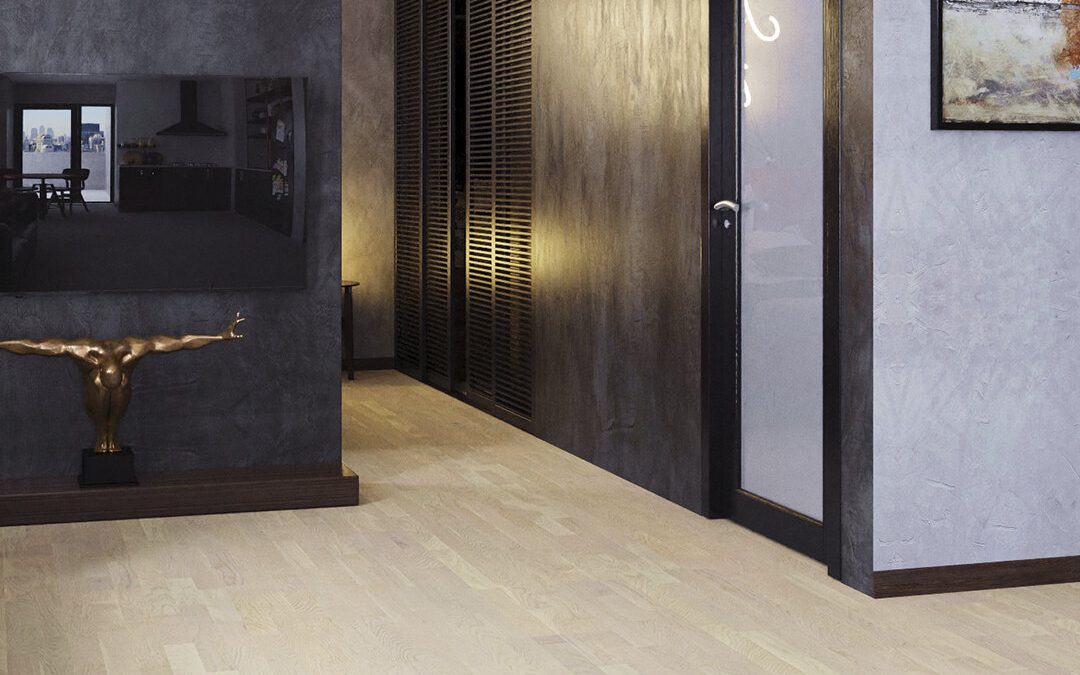 Vaalea lattia ja tummat lattialistat.